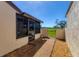 Enclosed patio of a tan stucco home with a view to a green golf course at 4532 La Jolla Dr, Bradenton, FL 34210