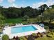 Community pool offers a tranquil escape with a pond and fountain in the background at 4532 La Jolla Dr, Bradenton, FL 34210