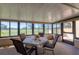 Inviting sunroom with views, a table with chairs and a scenic outdoor golf view at 4532 La Jolla Dr, Bradenton, FL 34210