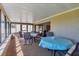 Bright sunroom with multiple tables and chairs for seating with scenic views at 4532 La Jolla Dr, Bradenton, FL 34210