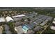 Aerial view of tennis courts, swimming pool, and multi-story complex in a private community at 4532 La Jolla Dr, Bradenton, FL 34210