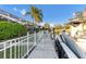 Modern boat docked at a private pier, with waterfront homes and lush landscaping views at 4620 Blue Marlin Dr, Bradenton, FL 34208