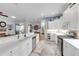 Bright, open-concept kitchen with white cabinets, stainless steel appliances, and seamless living area connection at 4620 Blue Marlin Dr, Bradenton, FL 34208