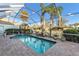 Enclosed pool area with a brick deck, and integrated spa, creating an outdoor oasis at 4620 Blue Marlin Dr, Bradenton, FL 34208