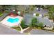 A captivating aerial view of the community pool surrounded by lush landscaping and parking at 4906 25Th W St # 106, Bradenton, FL 34207