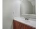 Bathroom with a single sink vanity and a decorative mirror at 4906 25Th W St # 106, Bradenton, FL 34207