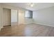 A spacious bedroom with a mirrored closet and a large window providing ample natural light to the space at 4906 25Th W St # 106, Bradenton, FL 34207