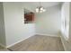 Bright dining area with wood floors adjacent to the kitchen offering a seamless flow for entertaining at 4906 25Th W St # 106, Bradenton, FL 34207