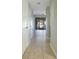 Hallway with tile floors leading to a screened patio offering a glimpse of outdoor living at 4906 25Th W St # 106, Bradenton, FL 34207