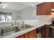 Convenient kitchen with a breakfast bar and a view to the dining and living areas at 4906 25Th W St # 106, Bradenton, FL 34207