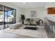 Bright living room features stylish furniture and a sliding glass door to the outside at 4906 25Th W St # 106, Bradenton, FL 34207