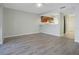 Open-concept living room with plank flooring and kitchen with a breakfast bar at 4906 25Th W St # 106, Bradenton, FL 34207