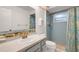 Bathroom with vanity, shower, and tropical decor at 5019 Village Gardens Dr # 31, Sarasota, FL 34234