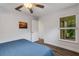 Bedroom featuring light wood floors, ceiling fan and neutral decor at 5019 Village Gardens Dr # 31, Sarasota, FL 34234