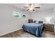 Bedroom featuring light wood floors and neutral decor at 5019 Village Gardens Dr # 31, Sarasota, FL 34234