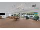 Spacious clubhouse with multiple seating areas, ceiling fans, and ample natural light at 5019 Village Gardens Dr # 31, Sarasota, FL 34234
