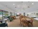 Bright clubhouse featuring cozy seating, tables, and a library for community enjoyment at 5019 Village Gardens Dr # 31, Sarasota, FL 34234