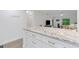 Spacious kitchen island with granite countertop and ample storage, open to dining and living areas at 5019 Village Gardens Dr # 31, Sarasota, FL 34234