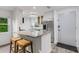 Well-designed kitchen with stainless steel appliances, granite countertops, and breakfast bar seating at 5019 Village Gardens Dr # 31, Sarasota, FL 34234