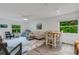 Inviting living room featuring modern decor, comfortable seating, and bright natural light through large windows at 5019 Village Gardens Dr # 31, Sarasota, FL 34234