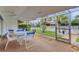 Screened-in patio with seating, perfect for enjoying the Florida weather at 5019 Village Gardens Dr # 31, Sarasota, FL 34234