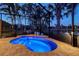 Inviting pool area featuring cool blue water, brick-paver patio, and palm trees, great for outdoor relaxation and entertainment at 5361 Sundew Dr, Sarasota, FL 34238