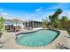Beautiful backyard featuring a pool, patio furniture, and an enclosed lanai at 6335 Granger Rd, Port Charlotte, FL 33981