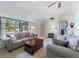 Inviting living room with neutral tones, plush seating, and bright natural light at 6335 Granger Rd, Port Charlotte, FL 33981