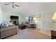 Cozy living room area showcasing neutral tones, comfortable furniture, and lots of natural light at 6335 Granger Rd, Port Charlotte, FL 33981