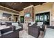 Outdoor area featuring a stone fireplace, wall-mounted television, and comfortable seating at 6737 Alstead Cir, Lakewood Ranch, FL 34202
