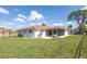 Expansive backyard featuring a screened-in patio and well-maintained lawn at 7431 Dickens Dr, Sarasota, FL 34231