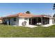 Charming home featuring a lovely screened-in patio and spacious backyard at 7431 Dickens Dr, Sarasota, FL 34231