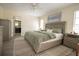 Bright bedroom with a queen-size bed, light gray walls, and a modern rug at 7431 Dickens Dr, Sarasota, FL 34231