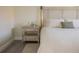 Bedroom featuring a nightstand, soft rug, and a luxurious upholstered headboard at 7431 Dickens Dr, Sarasota, FL 34231