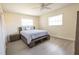 Bright bedroom features a platform bed with storage and neutral tones, creating a serene and organized space at 7431 Dickens Dr, Sarasota, FL 34231