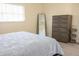 Bedroom boasts wood-look flooring, large windows, and a matching dresser at 7431 Dickens Dr, Sarasota, FL 34231