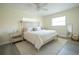 Bedroom with a comfy bed, stylish nightstand, and ample natural light at 7431 Dickens Dr, Sarasota, FL 34231