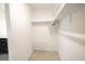 A simple walk-in closet with shelving at 7431 Dickens Dr, Sarasota, FL 34231