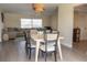 Open concept dining area next to the living room with modern table and chairs at 7431 Dickens Dr, Sarasota, FL 34231