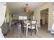 Bright dining area with view to living room featuring modern table, chairs, and stylish decor at 7431 Dickens Dr, Sarasota, FL 34231