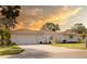 Charming single-story home boasts a well-manicured lawn and a two-car garage at 7431 Dickens Dr, Sarasota, FL 34231