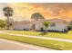 Inviting single-story home features lush landscaping and a paved driveway at 7431 Dickens Dr, Sarasota, FL 34231