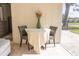 Enclosed lanai with comfortable seating and a table for dining or relaxing at 7431 Dickens Dr, Sarasota, FL 34231