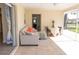 Bright lanai with comfortable seating, view to the backyard, and access to the interior at 7431 Dickens Dr, Sarasota, FL 34231