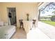 Cozy lanai featuring a table, chairs, and a glimpse of the outdoor view at 7431 Dickens Dr, Sarasota, FL 34231