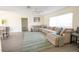 Cozy living room with a large sectional sofa, plush rug, and plenty of natural light at 7431 Dickens Dr, Sarasota, FL 34231