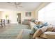 Inviting living room with a comfortable sectional sofa, stylish rug, and a view into other rooms at 7431 Dickens Dr, Sarasota, FL 34231