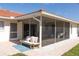 Inviting screened-in patio area perfect for outdoor relaxation and entertaining at 7431 Dickens Dr, Sarasota, FL 34231