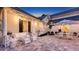 Cozy backyard patio with comfortable seating, string lights, and lush landscaping for relaxation and entertainment at 7715 Westmoreland Dr, Sarasota, FL 34243