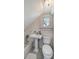 Cozy bathroom featuring vintage-style fixtures, clean white tile, and a bright window at 7715 Westmoreland Dr, Sarasota, FL 34243